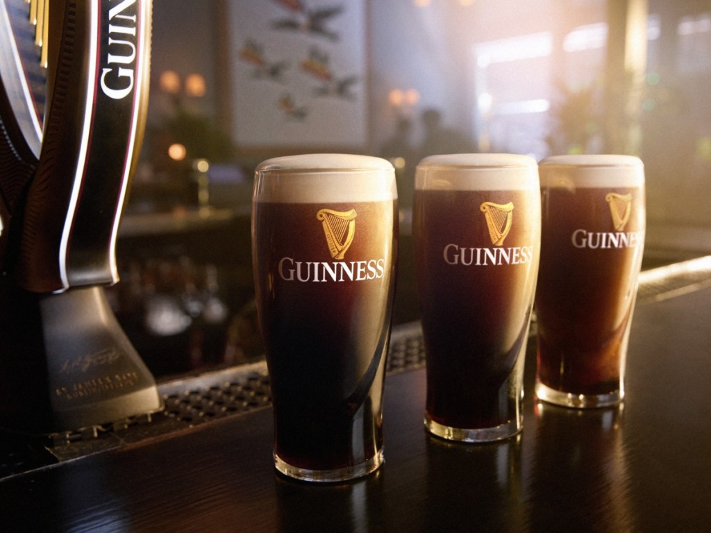3 glasses of Guinness on bar