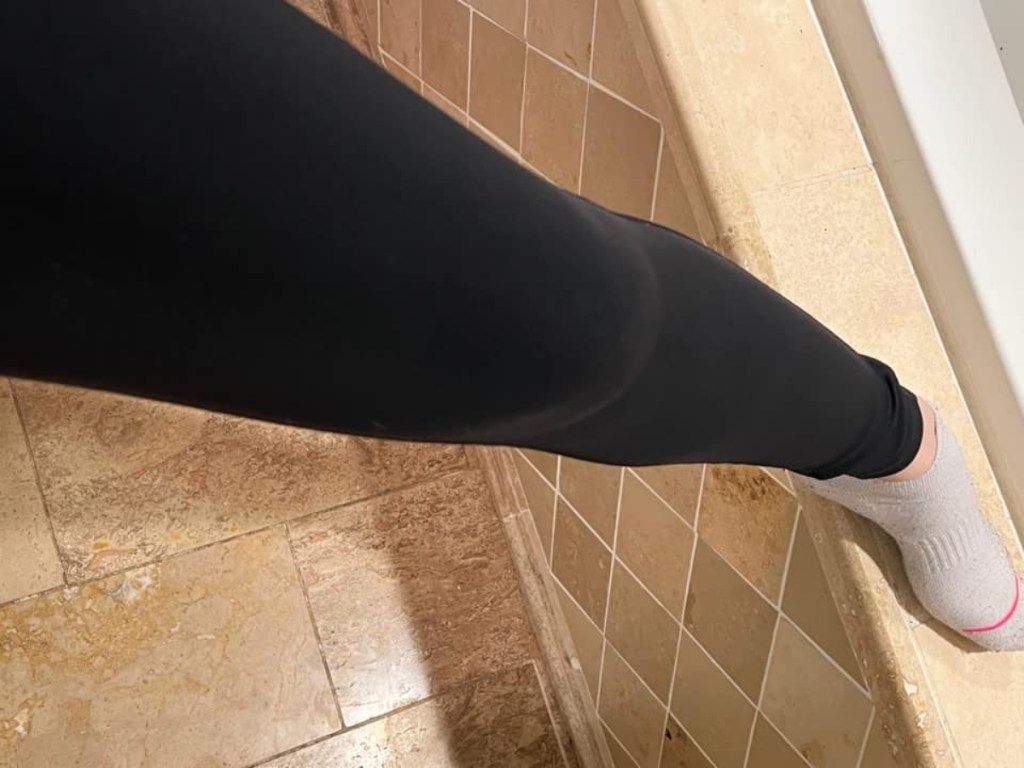 leg wearing black leggins