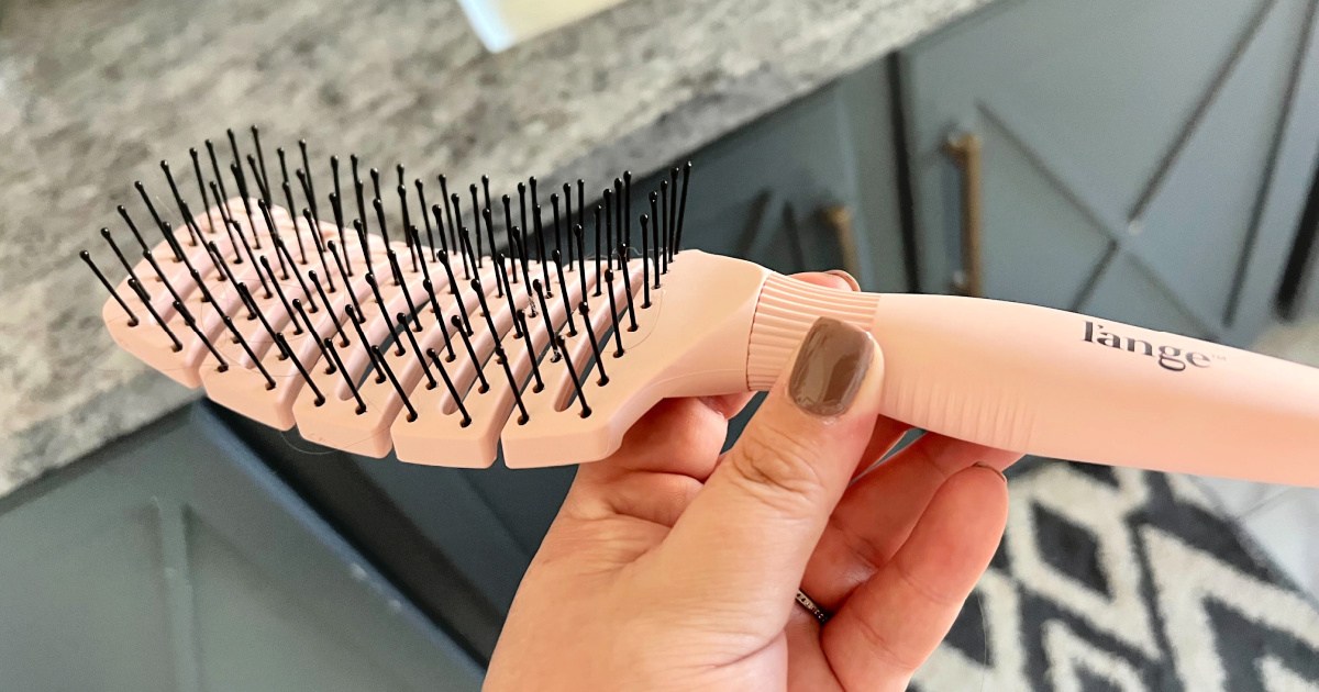 holding a l'ange hair brush