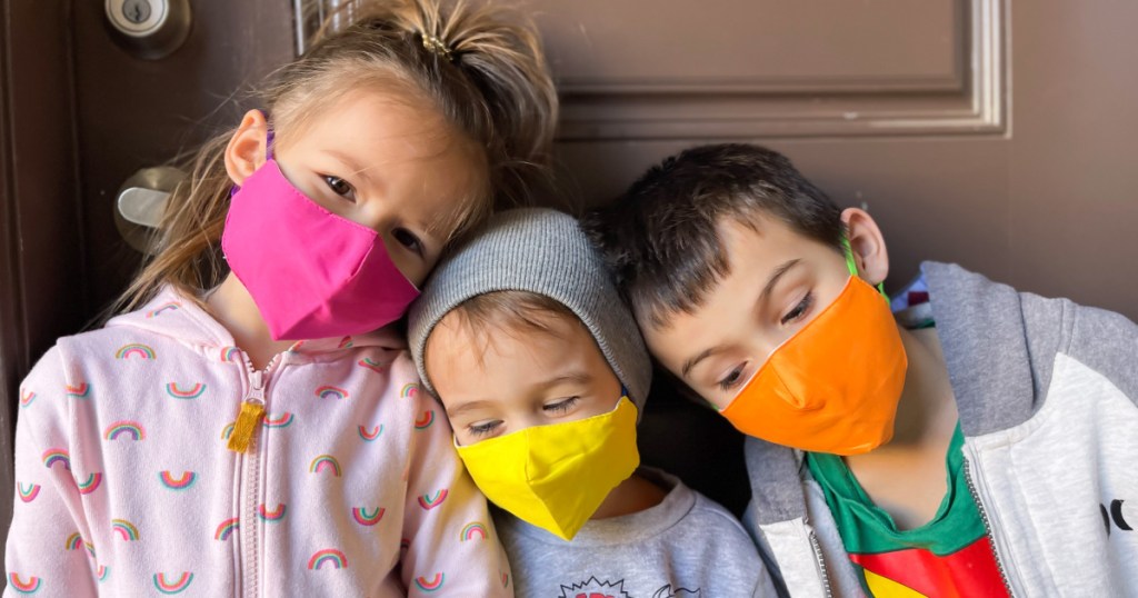 three kids wearing face masks