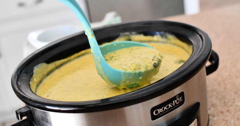 laddle of slow cooker broccoli cheddar soup