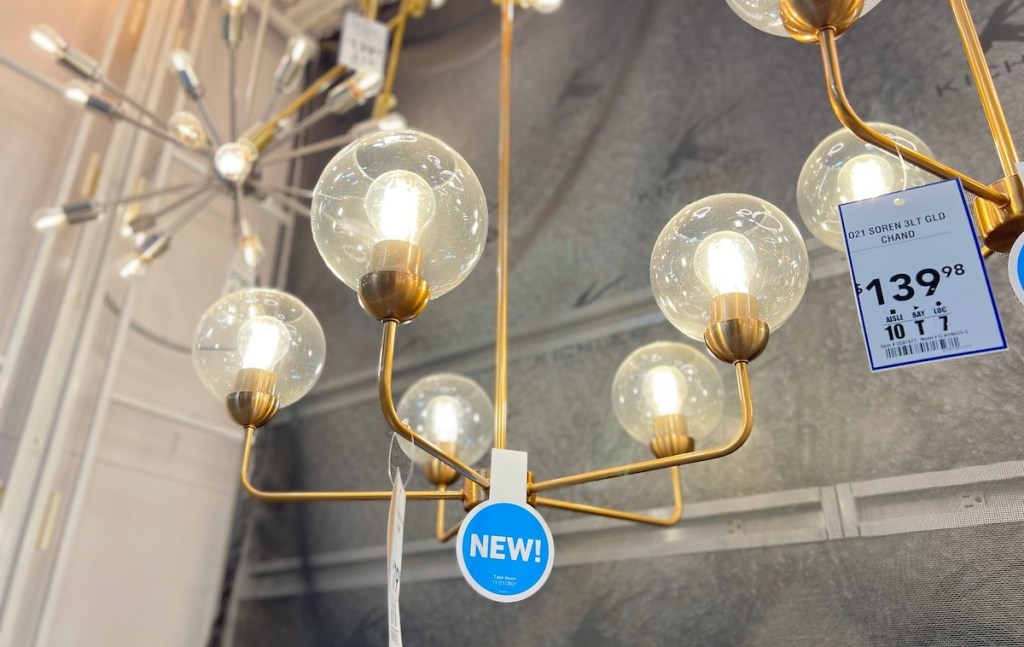gold globe chandelier with five lights hanging from lowes home house of style display