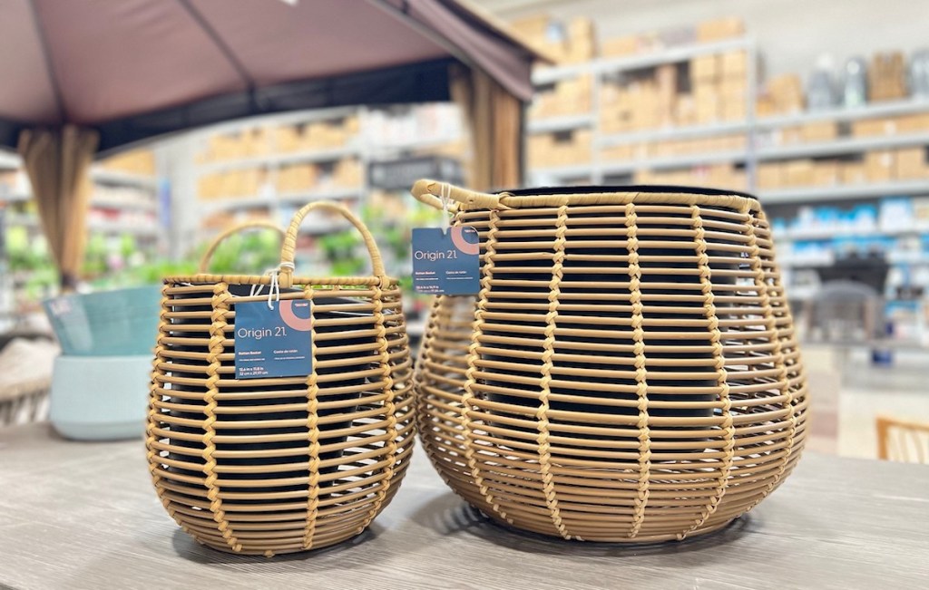 two different sized rattan baskets on store table in patio aisle