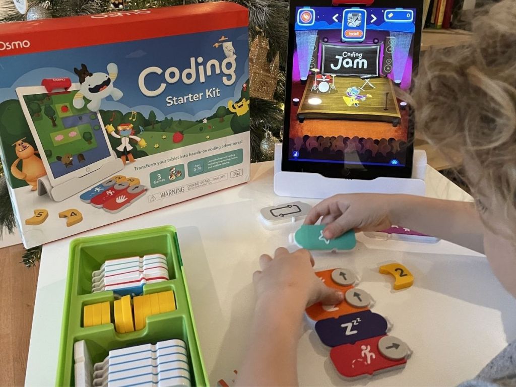 boy playing with Osmo Coding Starter Kit