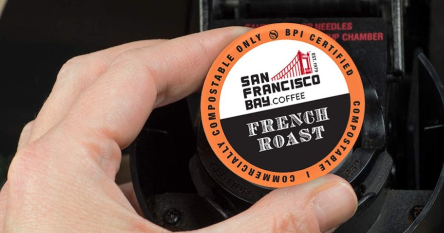 hand holding a San Francisco Bay Coffee k cup