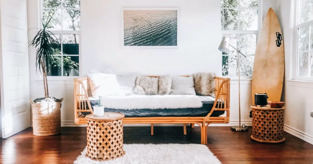 nautical living room with rattan daybed coffee tables and surf board