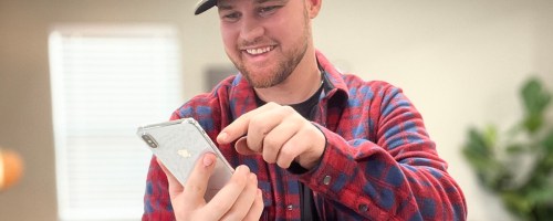 man on phone with hot deal text 'alerts
