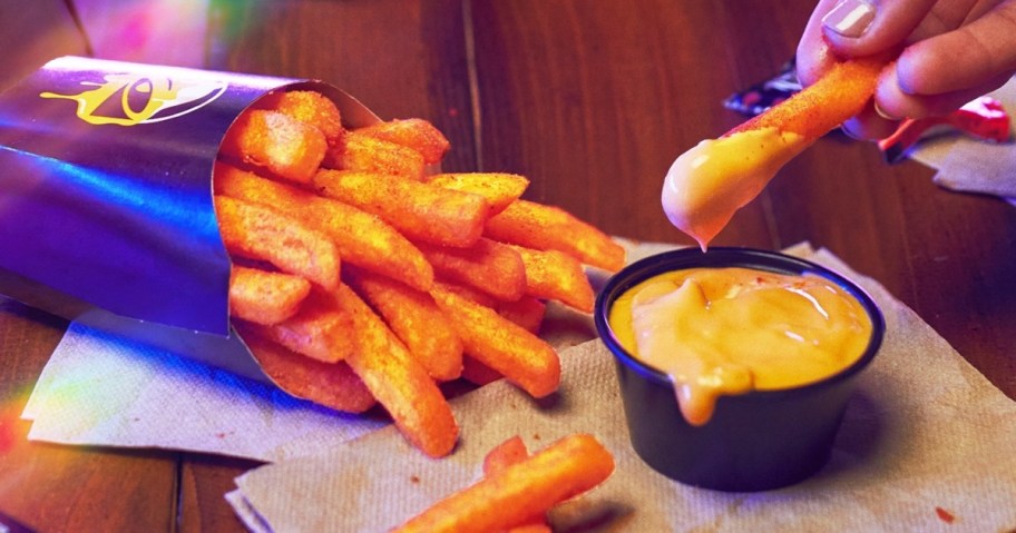 dipping fries into nacho cheese