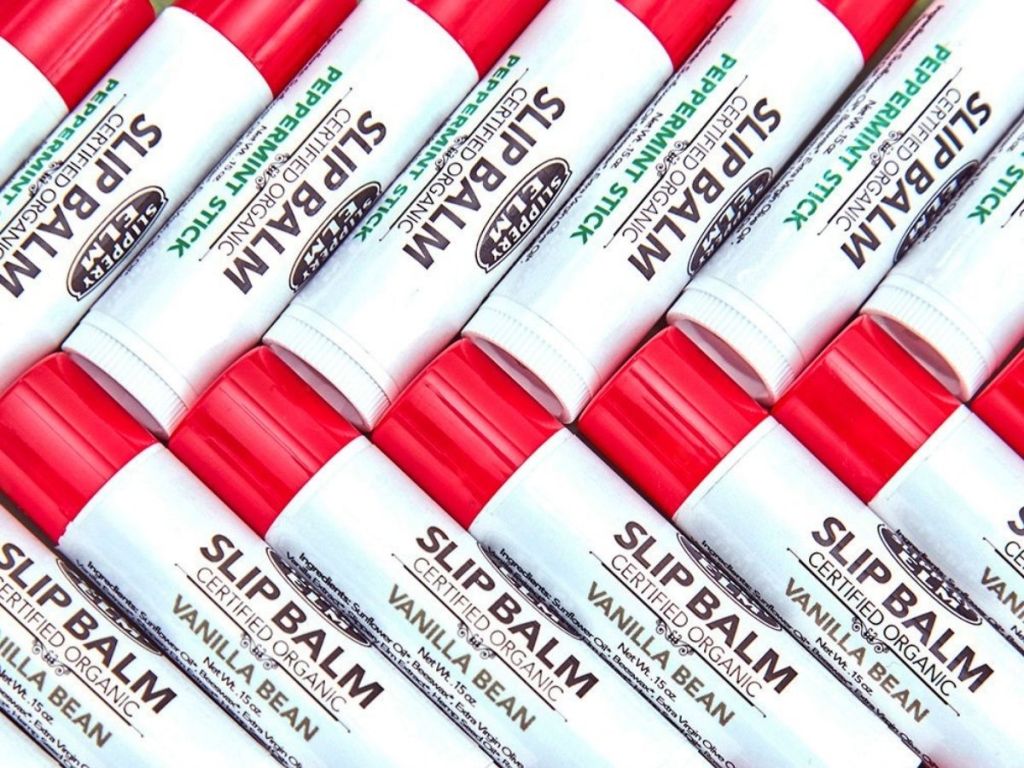 white tubes of lip balm with red lids