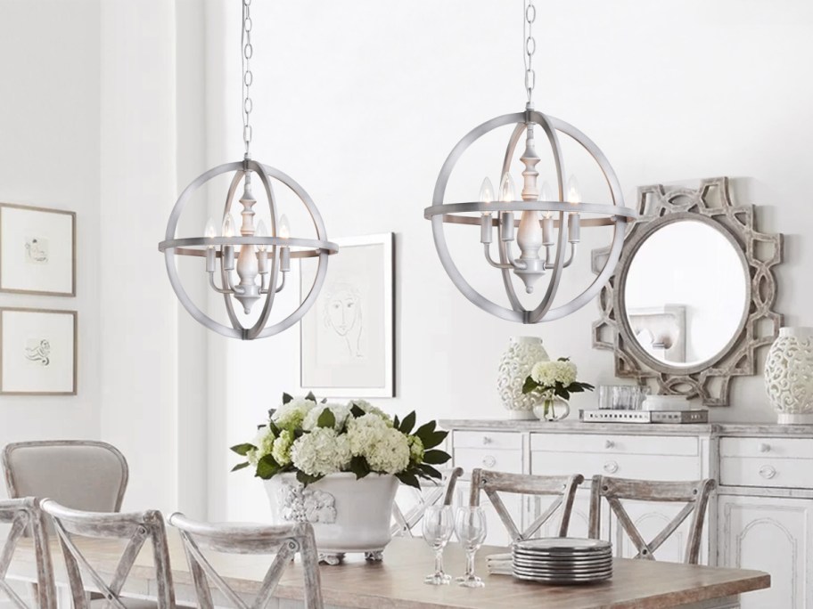 two pendent lights hanging on to[ go dining room table