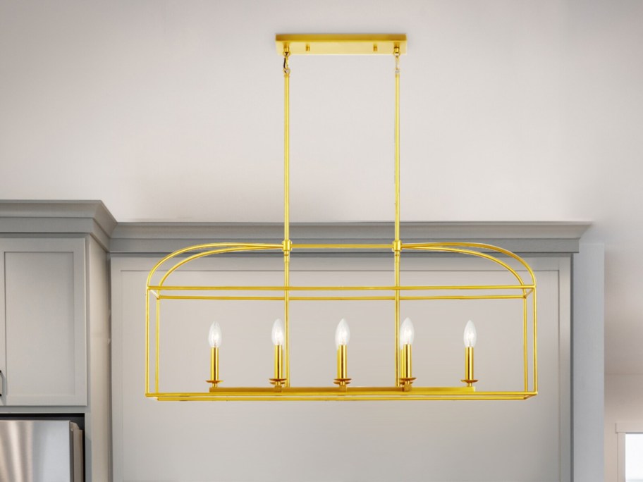 unique large gold light fixture showcased in a kitchen