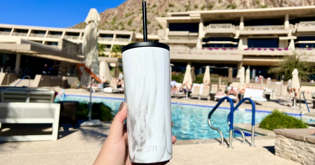 woman with simple modern tumbler by the pool