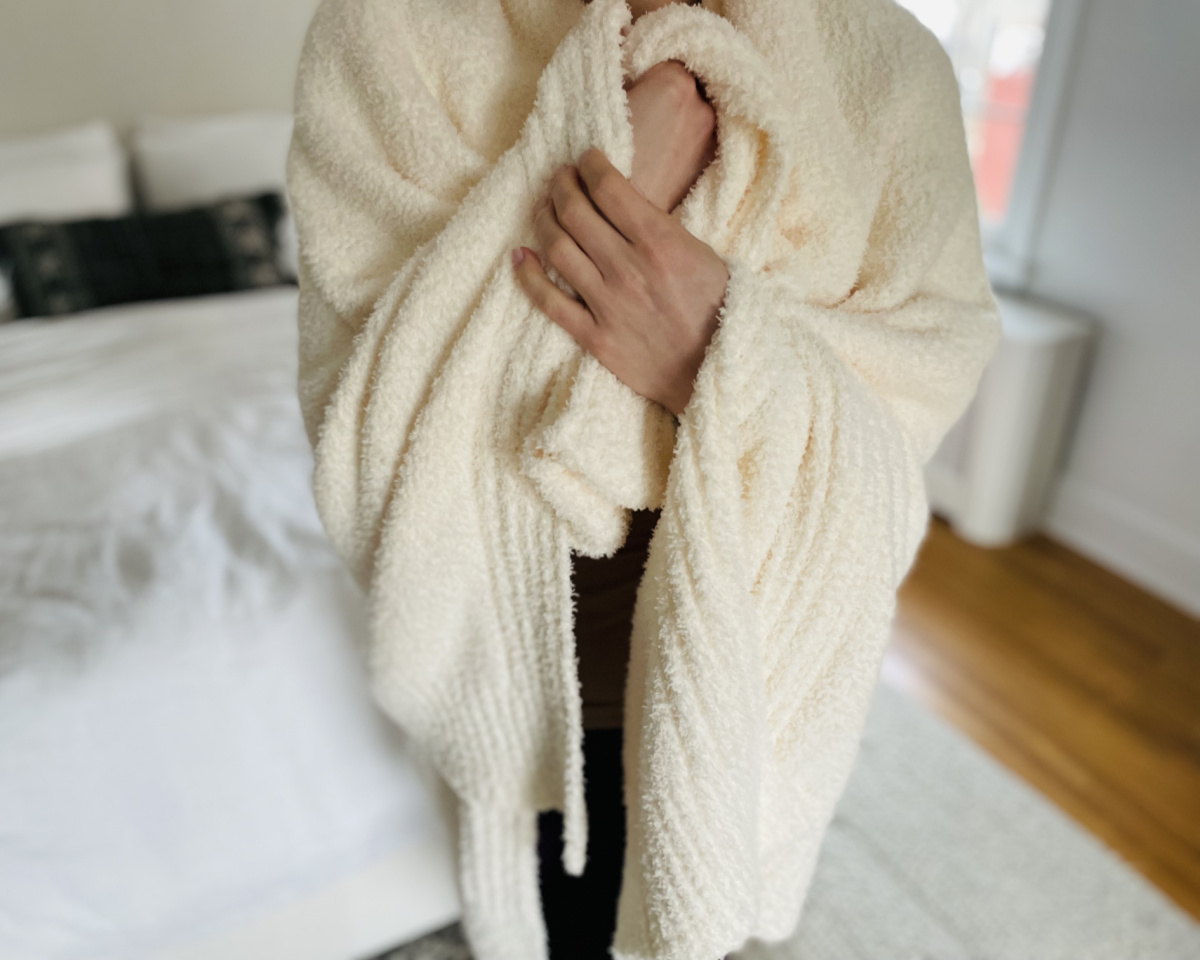 woman wrapped in white blanket
