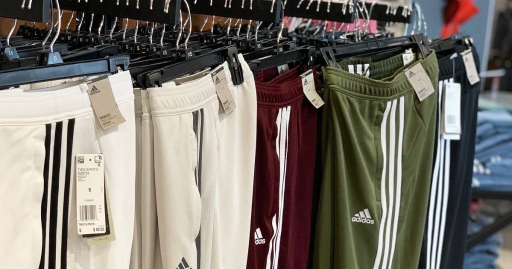 adidas pants on hangers in store