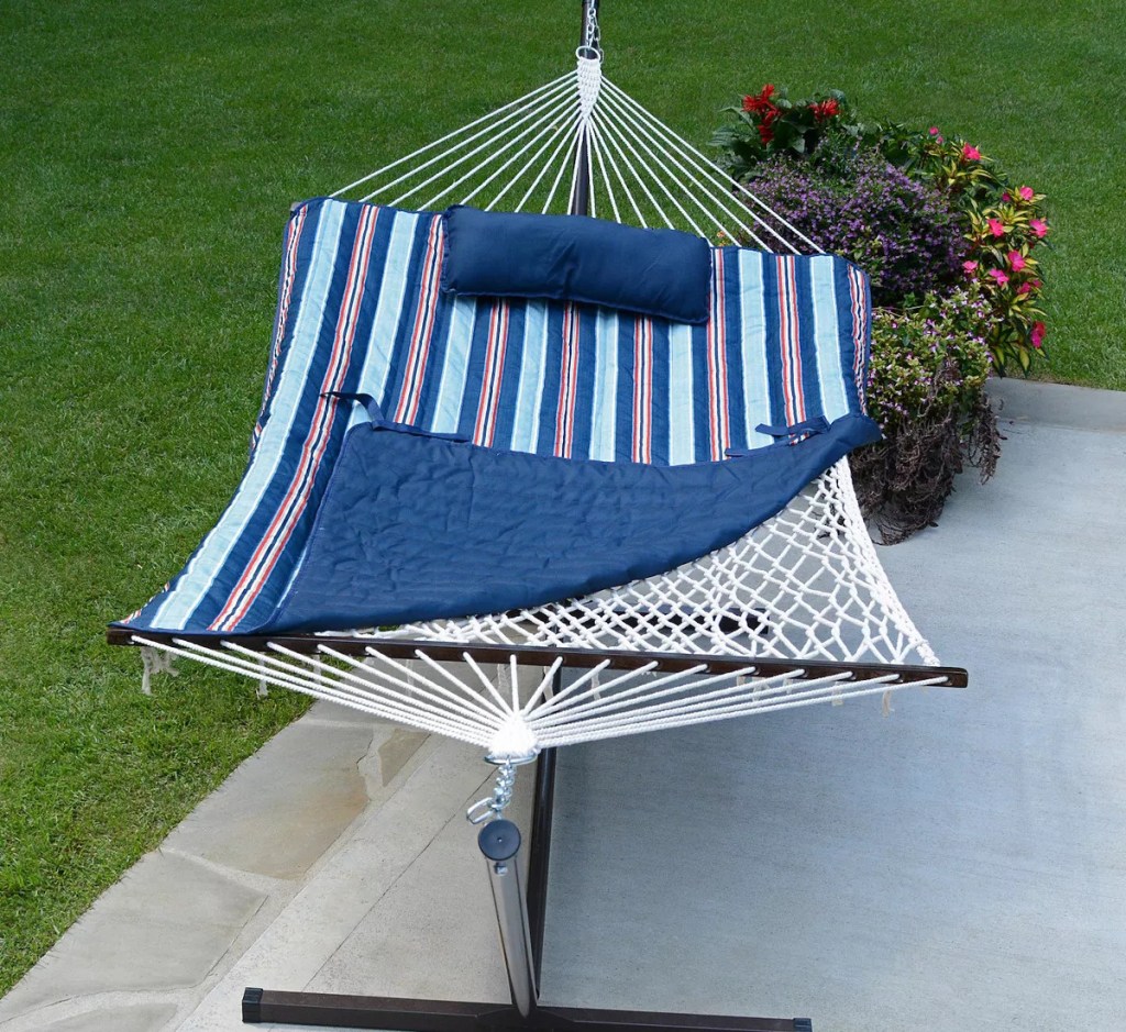 blue, white, and red striped hammock on patio
