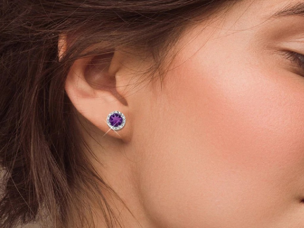 woman wearing diamond and amethyst earring