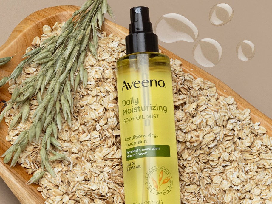 bottle of Aveeno Daily Moisturizing Oil Mist in bowl of oats