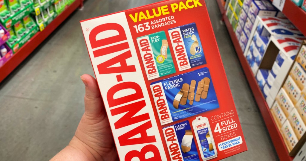 hand holding Band-Aid Brand Variety Pack Adhesive Bandages in store