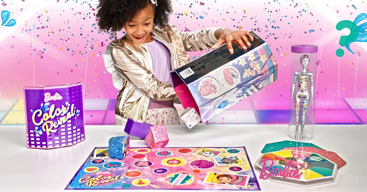 Girl unboxing Barbie Color Reveal Surprise set