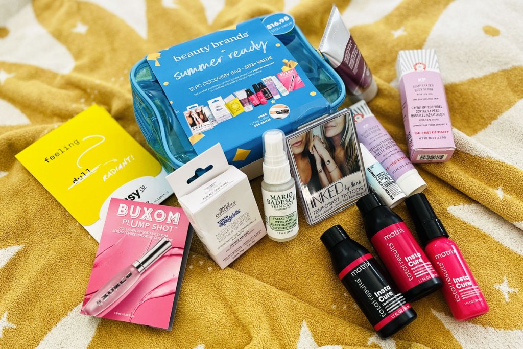 beauty samples and bag on bed
