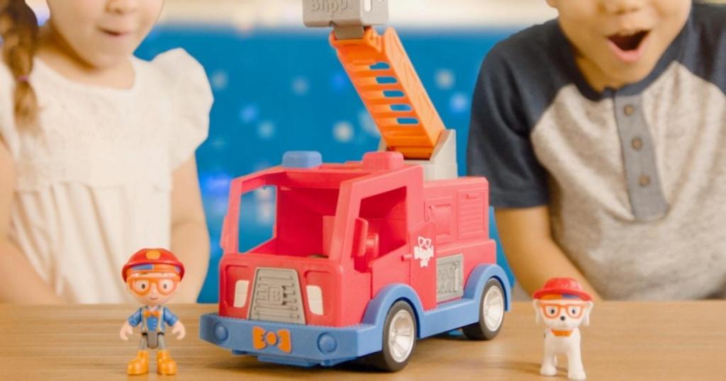 kids playing with blippi fire truck