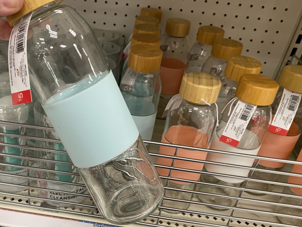 glass water bottles on store shelf