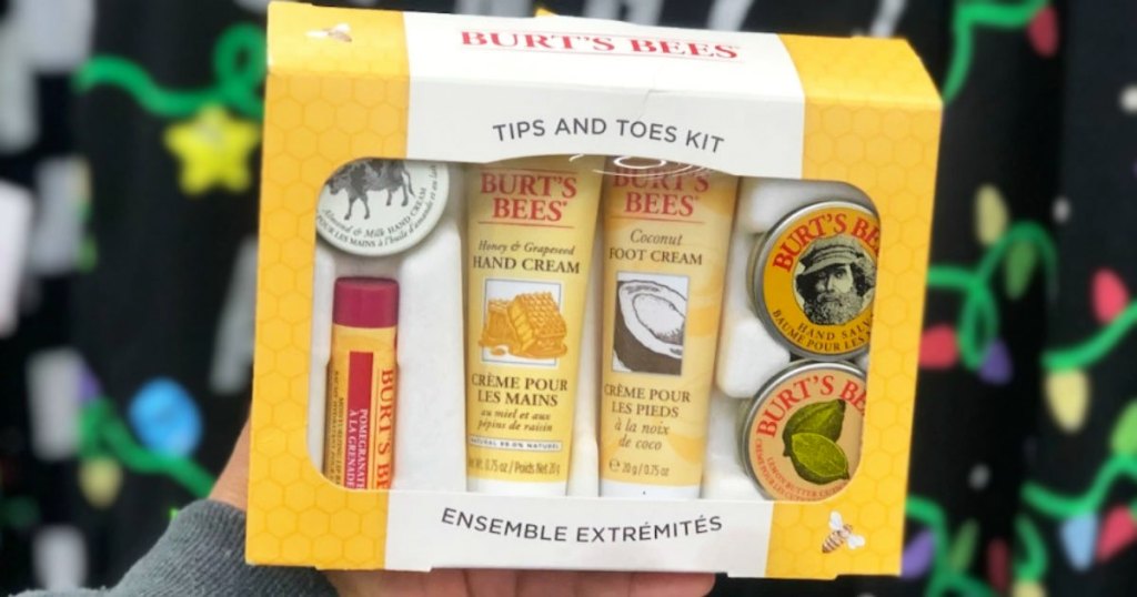 hand holding up a burt's bees gift set