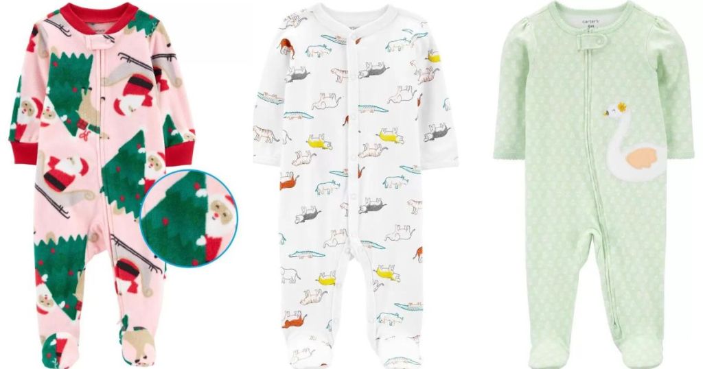 Three pairs of Carter's pajamas, the first with a Christmas print, second with dinosaurs and the third with a swan.