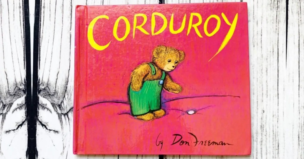 Corduroy Kids Book laying on white wooden background