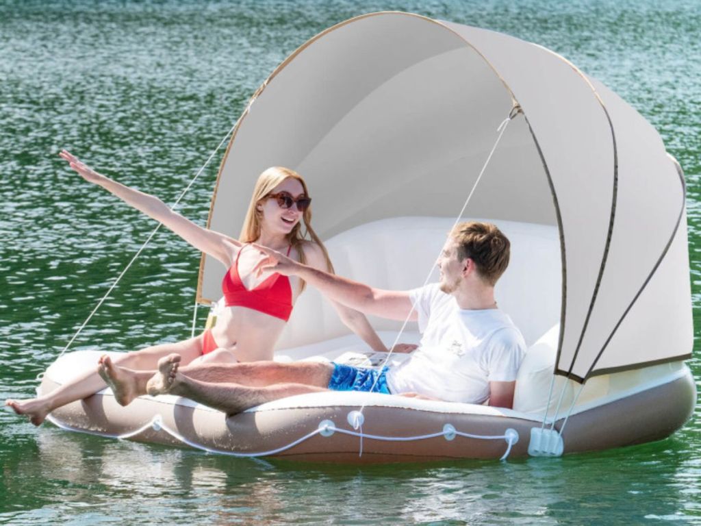 two people on a Costway Float on a lake