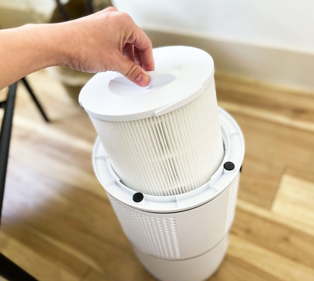 holding filter to Cozmor Air Purifier
