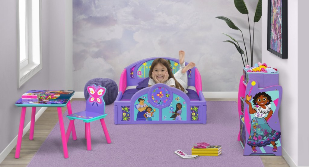 Delta Children Kids 4-Piece Room-in-a-Box Bedroom Sets with little girl in the bedroom