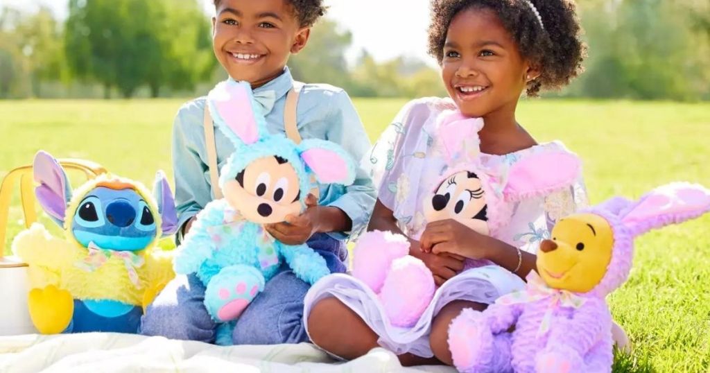 boy and girl holding Disney character Easter plush bunnies