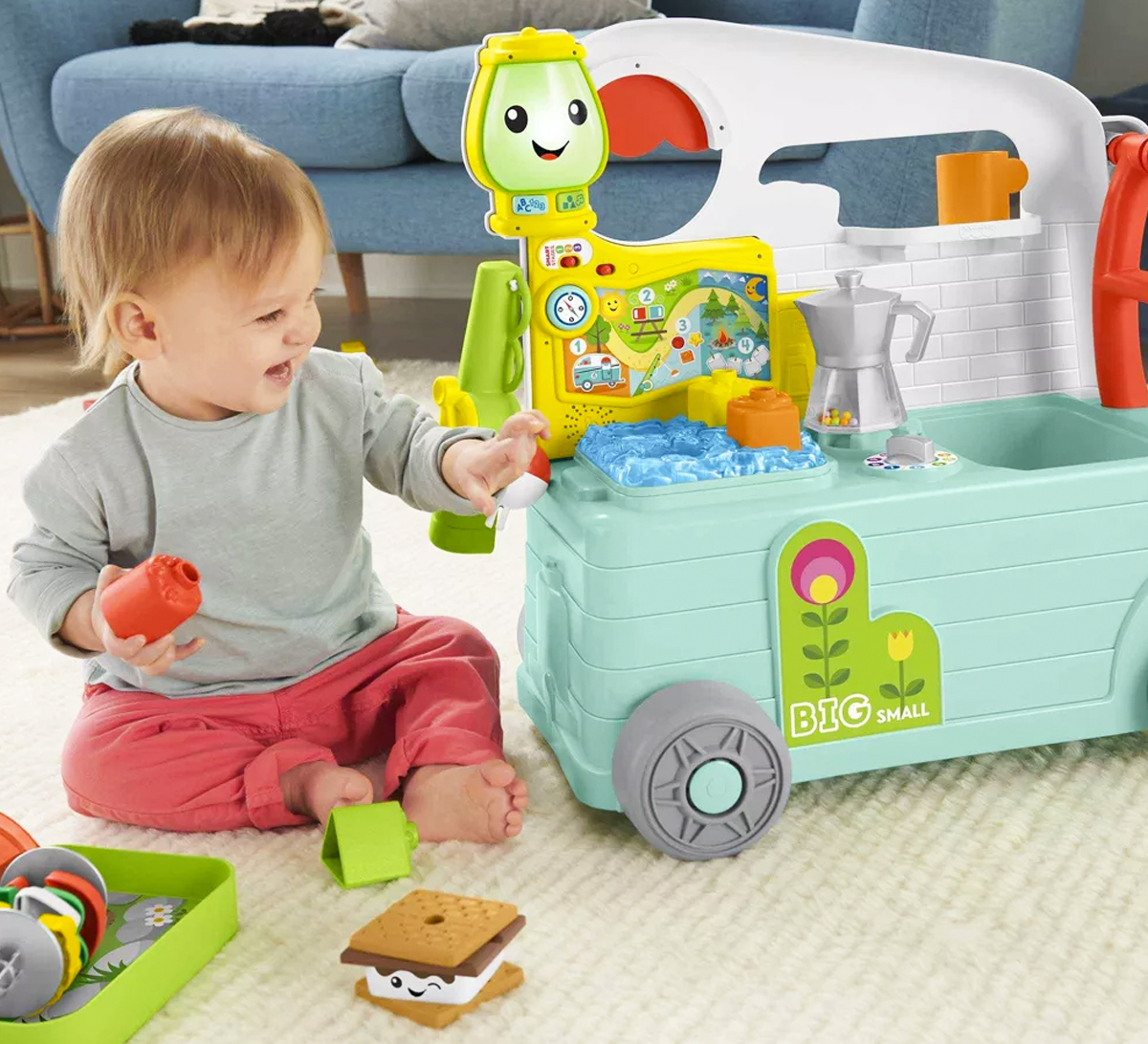 toddler playing with fisher price camper toy