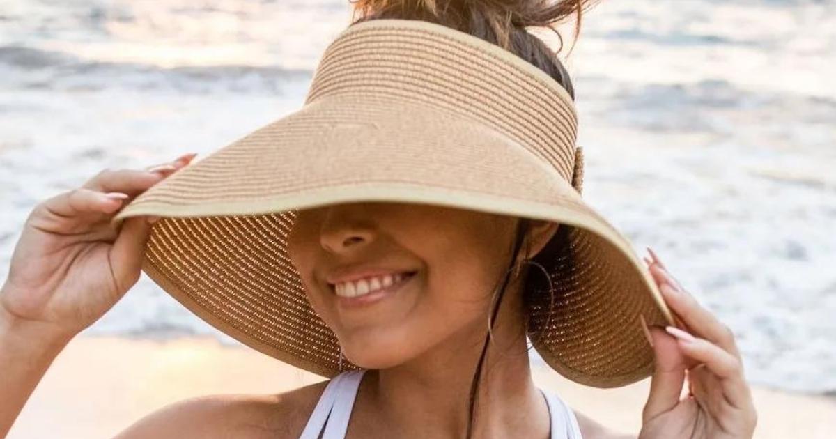 woman wearing a sun hat at the beach