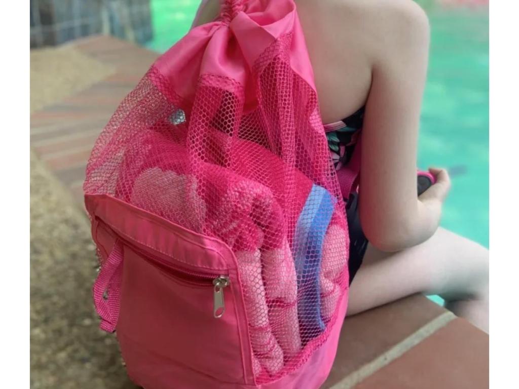 girl wearing pink foldable mesh backpack