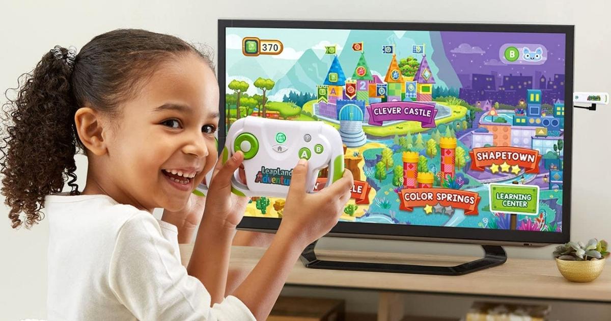 girl playing with LeapFrog LeapLand Adventures Learning Video Game