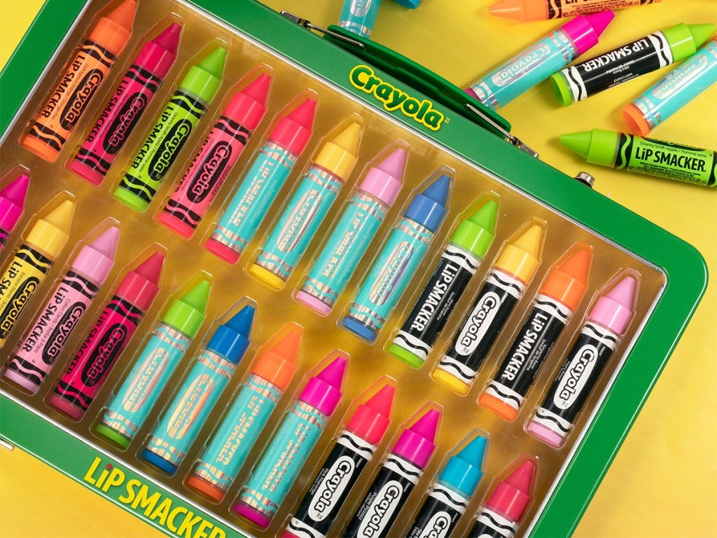 crayon-shaped lip balms in case and on table