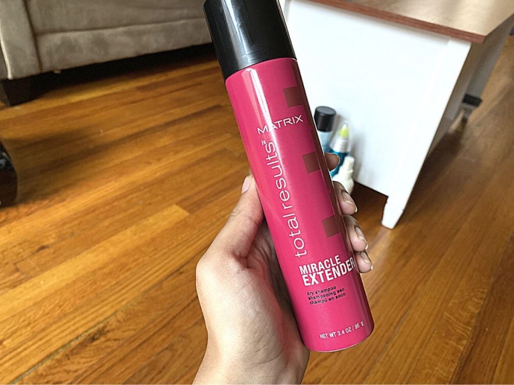 hand holding Matrix Total Results Miracle Extender Dry Shampoo