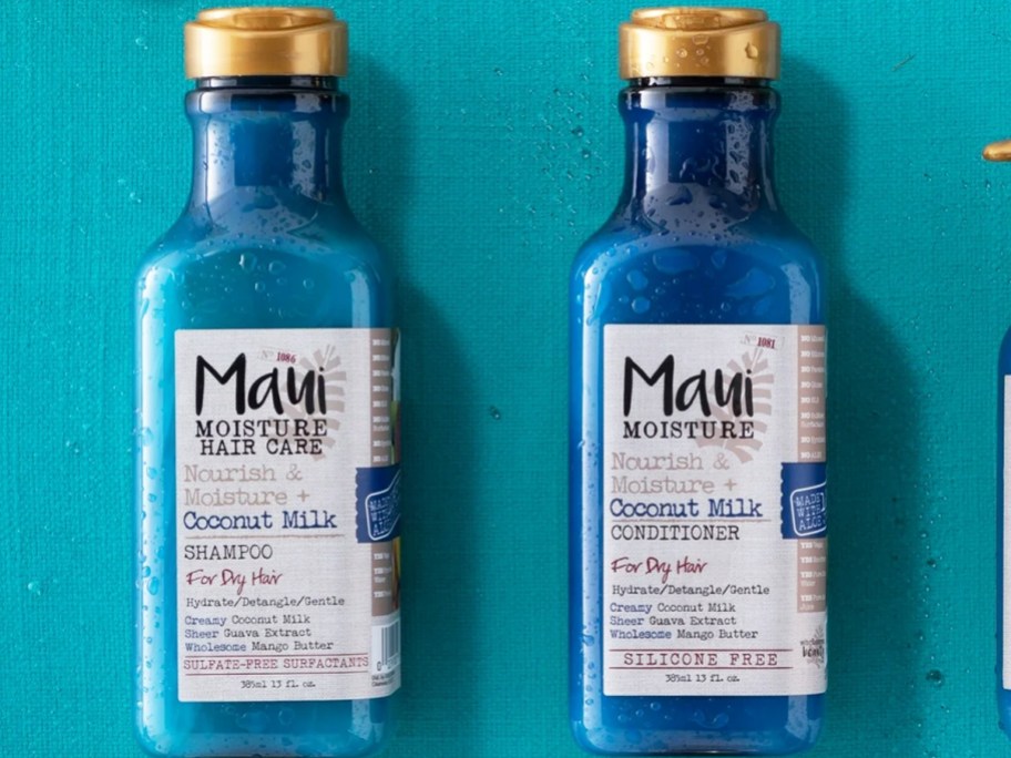 blue bottles of Maui Moisture Coconut Milk Shampoo & Conditioner on a blue background