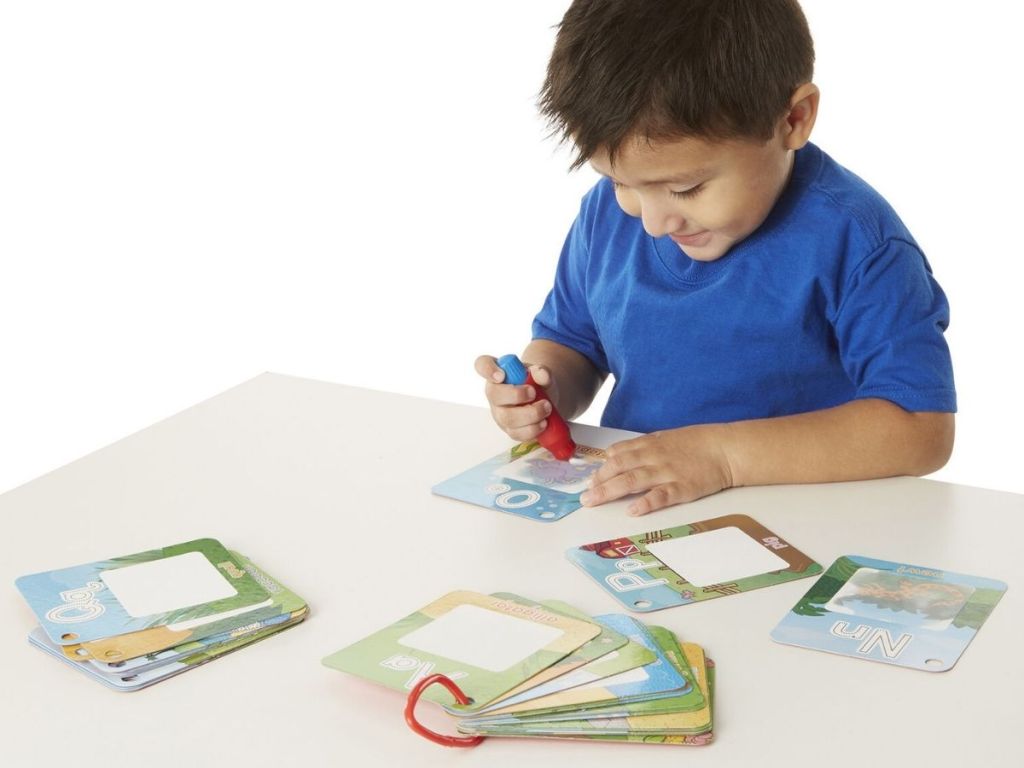 boy playing with Melissa & Doug Water Wow! Alphabet Cards - On the Go Travel Activity