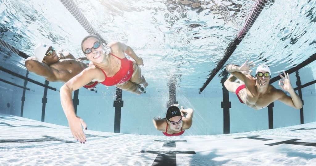 people in a swimming pool under water