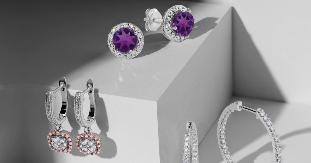 three pairs of diamond earrings