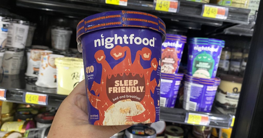 hand holding up pint of nightfood ice cream