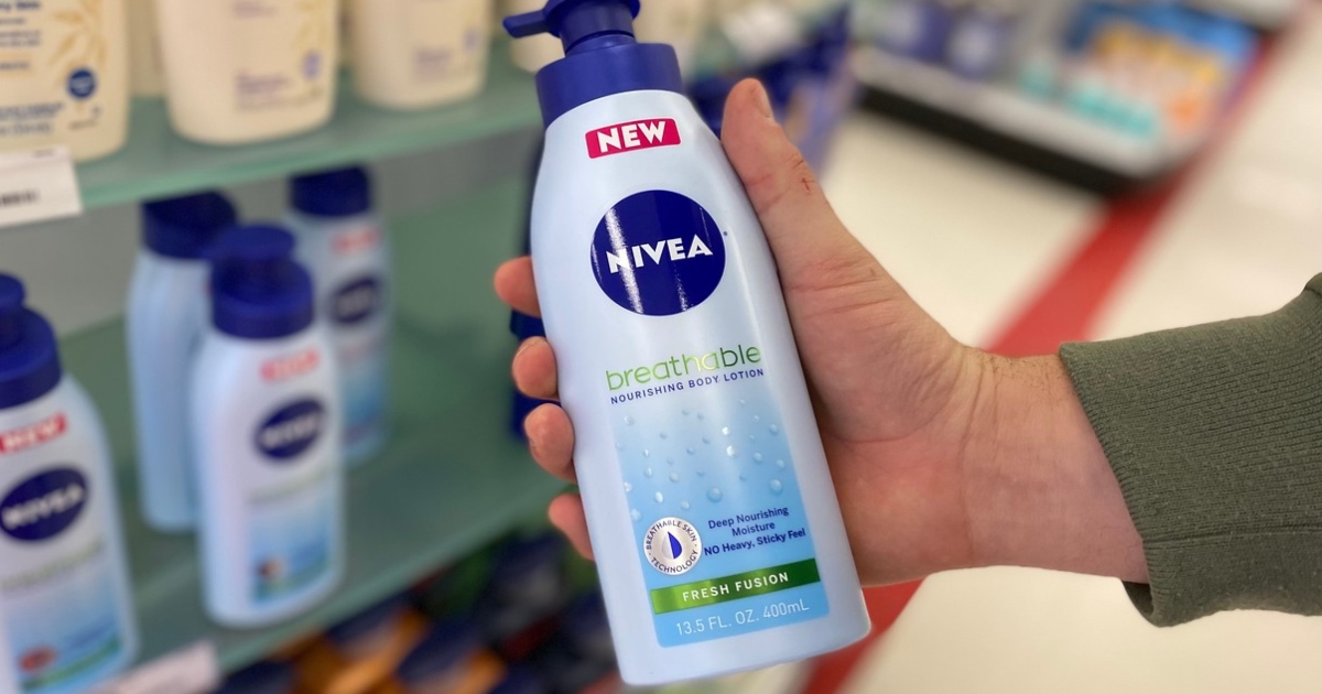 hand holding Nivea breathable body lotion in store