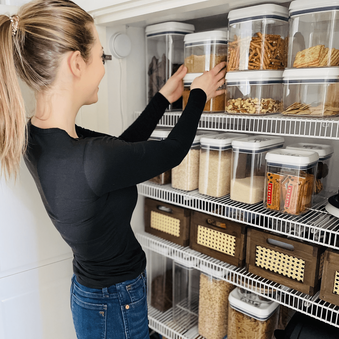 woman organizing a pantry and demonstrating how to easily declutter your home