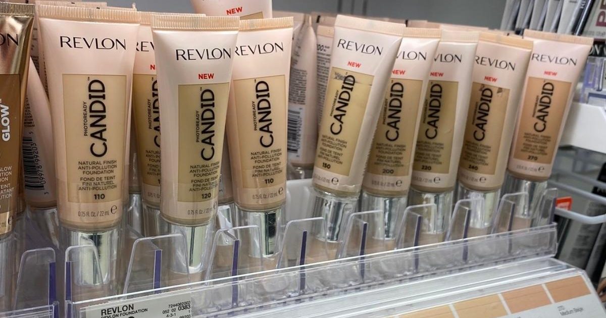 tubes of revlon foundation on a store display rack