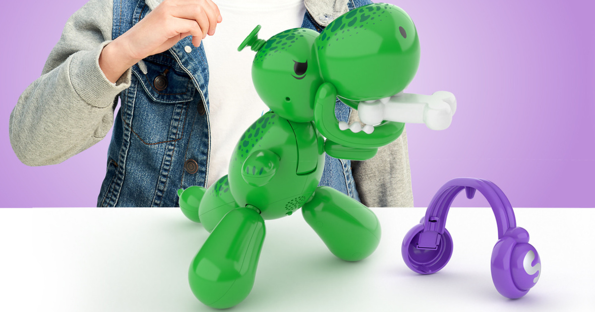 boy playing with interactive dinosaur balloon toy