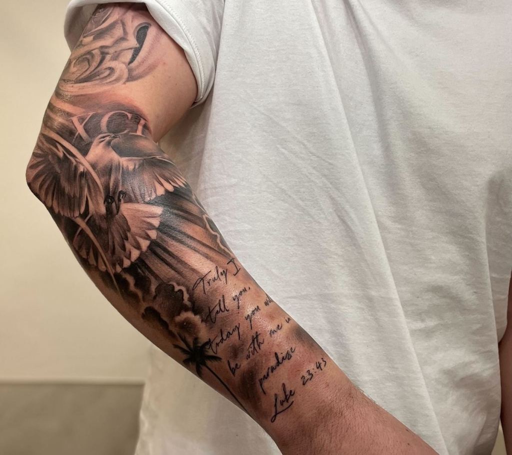 close up of arm with tattoos