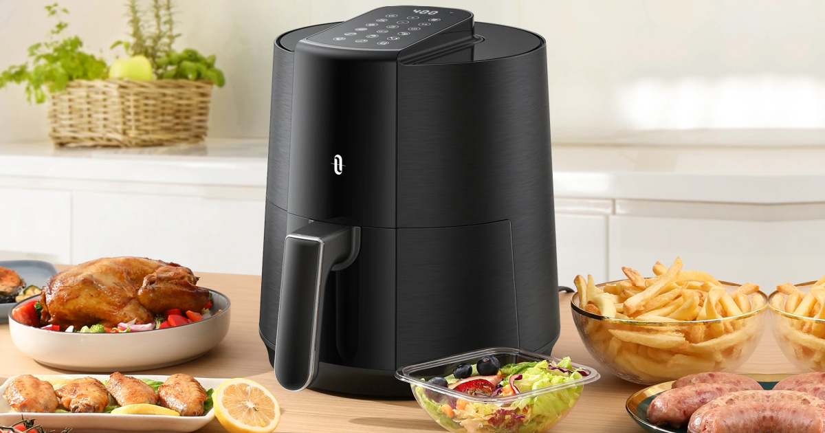 large digital air fryer on counter top near food